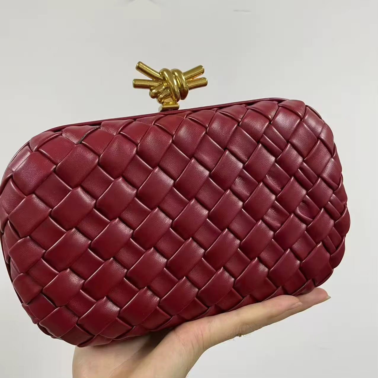 Woven Leather Clutch in Deep Burgundy with Gold Knot Clasp