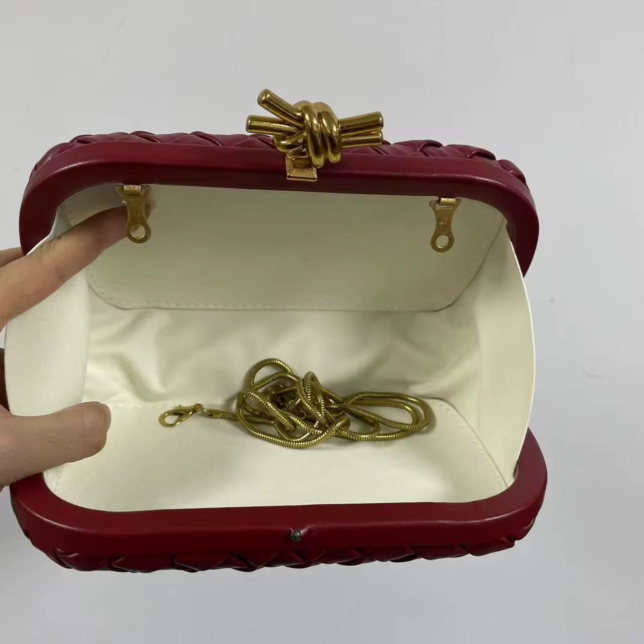 Woven Leather Clutch in Deep Burgundy with Gold Knot Clasp