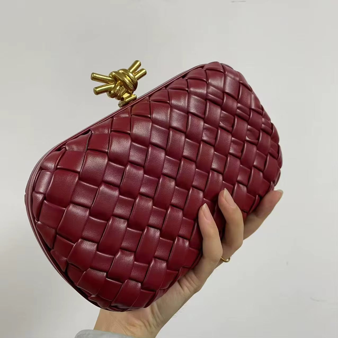 Woven Leather Clutch in Deep Burgundy with Gold Knot Clasp